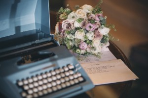 Typewriter and wedding bouquet