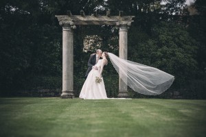 Bride and groom on lawn