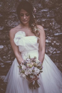 Bride holding bouquet of flowers