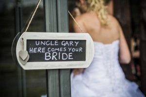 Bride by novelty sign