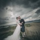 Bride and groom in dramatic scenery