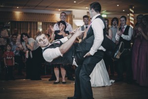 Groom and best man do a fun dance