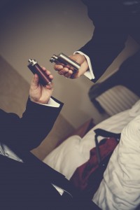 Groom with hip flask close up