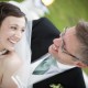 Bride and groom smile at each other