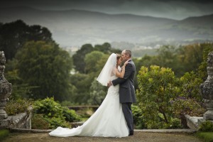 Bride and groom in front of trees
