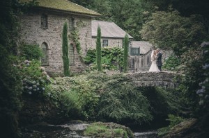 Bride and groom on old style bridge